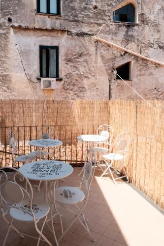 a group of tables and chairs on a patio at Casa Maria Al Campo in Salerno