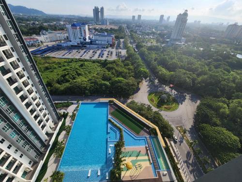 an overhead view of a swimming pool in a city at Metropol Serviced Apartment in Bukit Mertajam