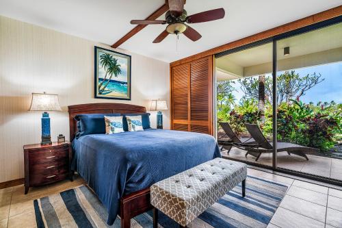 a bedroom with a bed and a ceiling fan at Mauna Lani Terrace J101 in Waikoloa