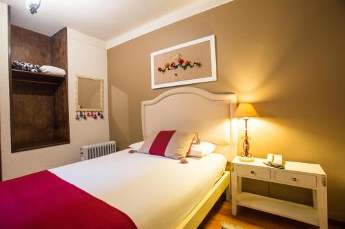 Кровать или кровати в номере Hotel Rosario La Paz
