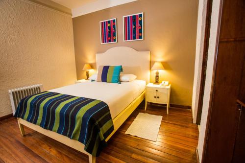Кровать или кровати в номере Hotel Rosario La Paz