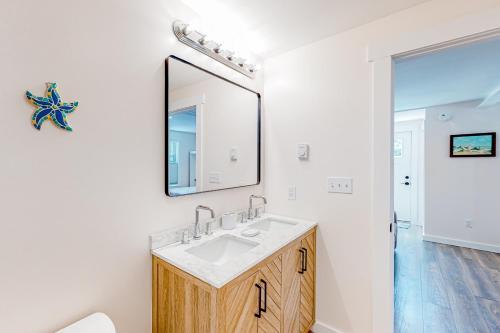 a bathroom with a sink and a mirror at Shorelands 44-1 in Kennebunk