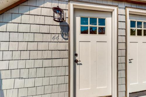 a garage with a white door and windows at Shorelands 44-1 in Kennebunk