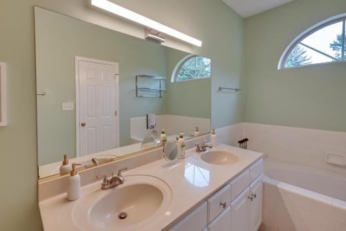 a bathroom with two sinks and a large mirror at Gorgeous Lexington Retreat about 2 Mi From UK! in Lexington