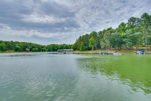 a large lake with a dock in the middle of it at Peaceful Lake Hartwell Gem with Boat Dock in Martin