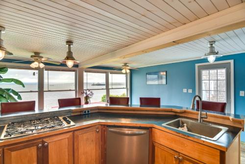 a large kitchen with blue walls and a sink at Massachusetts Vacation Rental 5 Mi to Fall River in Somerset