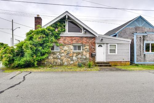 a brick house with a stone wall at Massachusetts Vacation Rental 5 Mi to Fall River in Somerset
