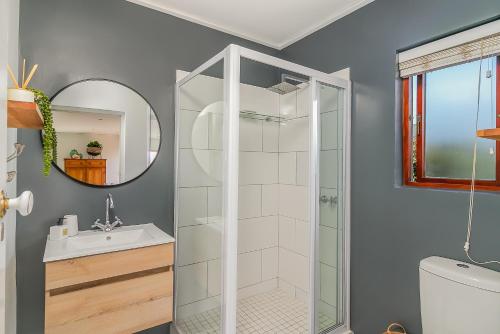 a bathroom with a shower and a sink at Founders Keepers - Leisure Isle in Knysna