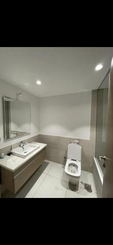 a bathroom with a toilet and a sink at marassi chalet in El Alamein