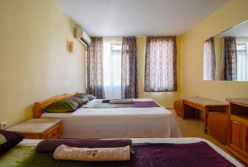 A bed or beds in a room at Fener Guest House