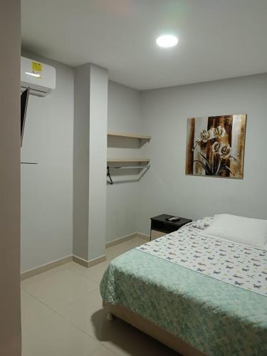 Ένα ή περισσότερα κρεβάτια σε δωμάτιο στο Hotel Prado 53