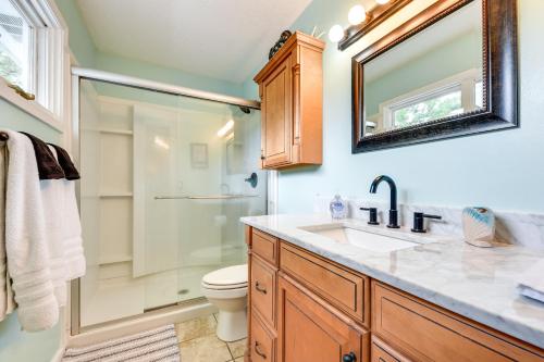 a bathroom with a toilet and a sink and a shower at St Simons Island Home 2 Blocks to Beach! in Saint Simons