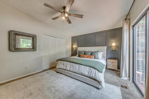 a bedroom with a bed and a ceiling fan at 1 Mi to Ski Slopes Alto Escape with Game Room! in Alto