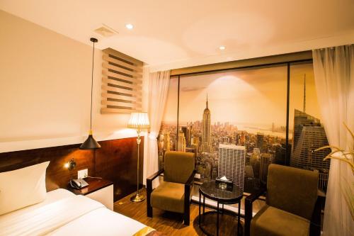a hotel room with a view of a city at Tuong Vi Hotel in Hai Phong