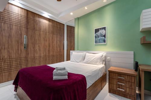 Cama o camas de una habitación en Conforto em Copacabana - Feito para famílias - RP602 Z4