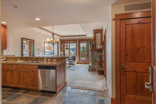a kitchen with a sink and a stove top oven at Luxury Condo in the Village at Northstar in Truckee