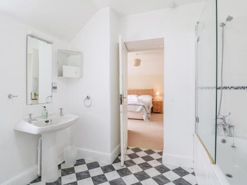a bathroom with a sink and a shower at Home Farm 16 in Witney
