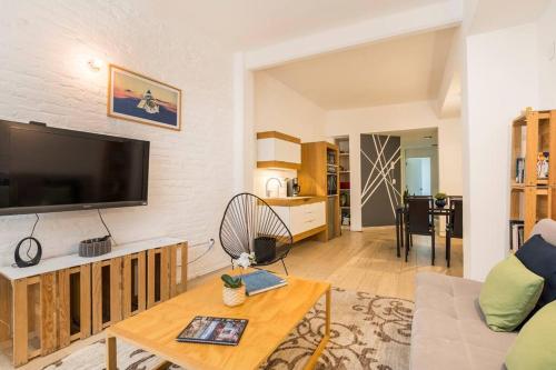 a living room with a large flat screen tv at Loft Donceles 6 CDMX! in Mexico City