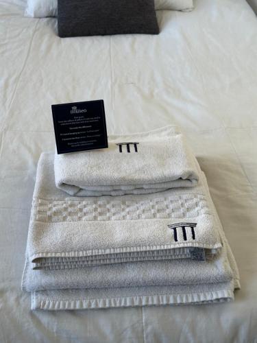 two towels sitting on top of a bed at El Museo Hotel Boutique in La Paz