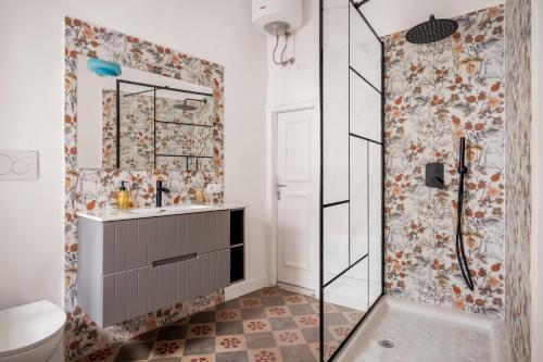 a bathroom with a shower and a sink at 124 Maqueda Apartments in Palermo