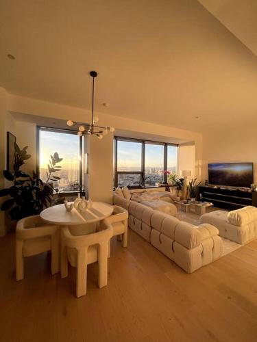 a living room with a couch and a table at Luxury Highrise Condo Downtown LA in Los Angeles
