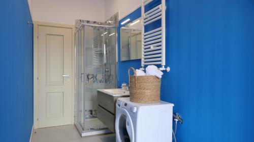 a bathroom with a sink and a shower and a toilet at Maison Lucia in Castellammare di Stabia