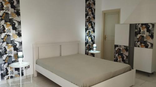 A bed or beds in a room at La casa di Nanà in centro