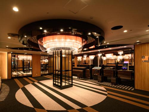 a large room with a chandelier in a building at APA Hotel Sapporo Odori Ekimae Minami in Sapporo