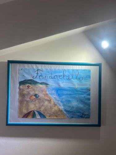 un quadro di un dipinto appeso a un muro di Casa Vacanze Bedda do Ziu a Mascali