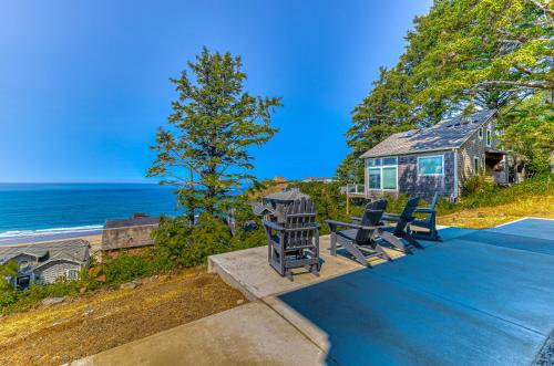 a house with two chairs and a table on a patio at Oceanside Skies in Oceanside