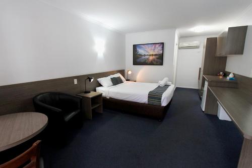 Postel nebo postele na pokoji v ubytování Sugar Country Motor Inn