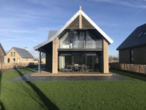 Modern design lodge directly at the water, in national park