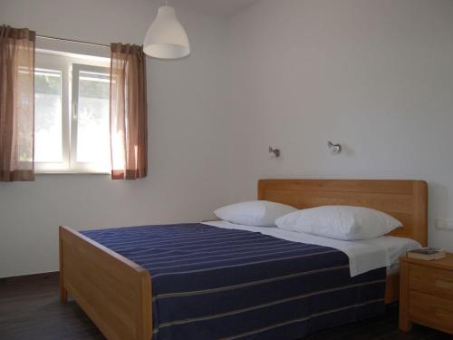 Ένα ή περισσότερα κρεβάτια σε δωμάτιο στο Apartment in Veli Rat near Beaches