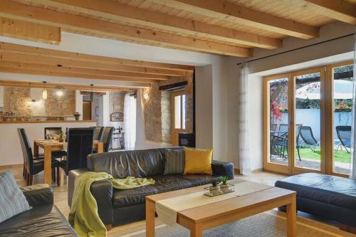 a living room with a couch and a table at Villa in Batlug with Private Pool in Batlug