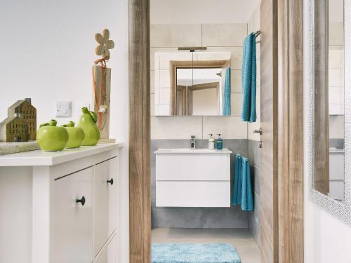 a bathroom with a sink and a mirror at Modern Villa with Pool and Parasol in Pula in Pula