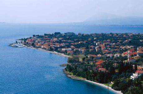an aerial view of an island in the water at Holiday Tolofona Beach in Eratini