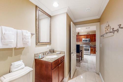 a bathroom with a sink and a toilet in a room at Emerald Grande W621 in Destin