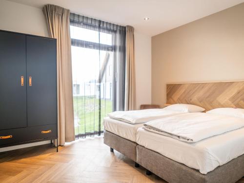 Postel nebo postele na pokoji v ubytování Villa near Texel Beach with Sauna