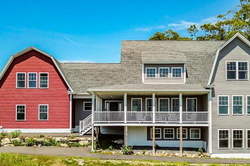 a house with a red and white house at Andersen Studio Suite in East Boothbay