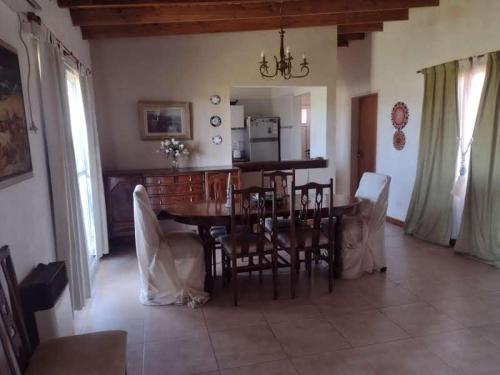 a dining room with a table and chairs at El Resueyo de Saladillo in Saladillo