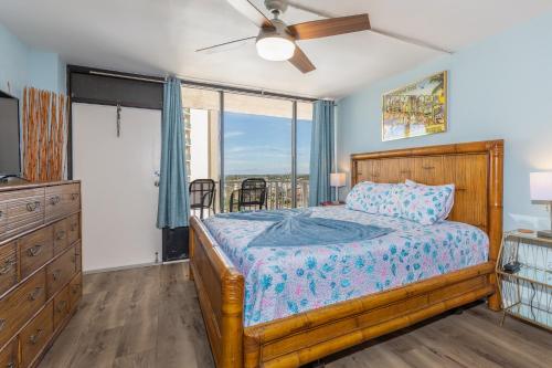 a bedroom with a bed and a large window at MCM Retro Beachfront Studio Great View, King Bed Remodeled in Daytona Beach