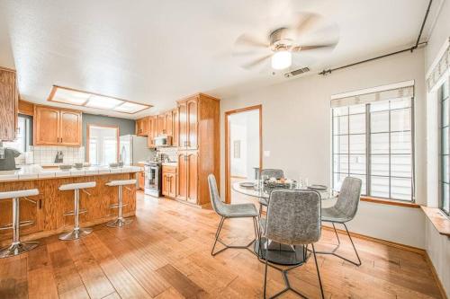 a large kitchen with a table and chairs in it at Stylish 3BR/2BA Retreat w/ Pool! Dream Getaway in Fresno