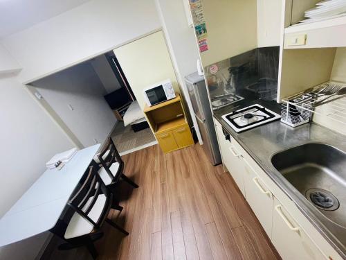 Una cocina o zona de cocina en SUNPIA WOMBLE GATE l 大滝町