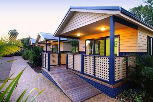 a house with a wooden deck in front of it at BIG4 Breeze Holiday Parks - Busselton in Busselton