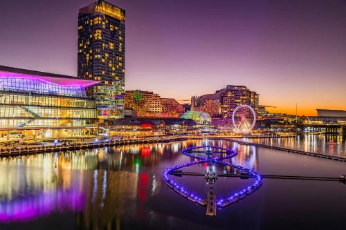 a city skyline with a river and buildings at Crowne Plaza Sydney Darling Harbour by IHG in Sydney