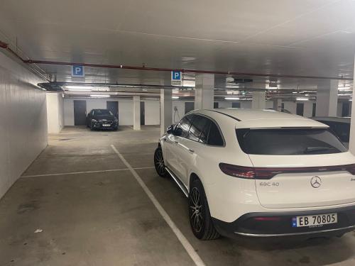 a white car parked in a parking garage at Førde in Førde
