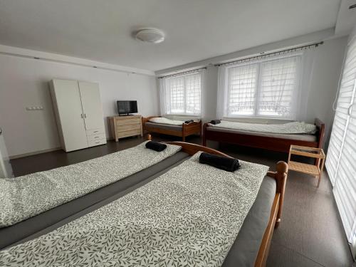 Postel nebo postele na pokoji v ubytování Apartament Dzierzecin