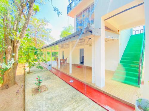 an aerial view of a house with a porch at Ima Villa Sigiriya in Sigiriya
