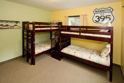two sets of bunk beds in a room at Moderne Hostel in Mammoth Lakes