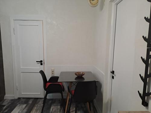 a dining room with a table and two chairs at Loft Comfort House in Yerevan in Yerevan